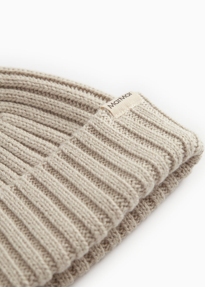 Barely beige with ribbed edge and vertical stripes, plus label.