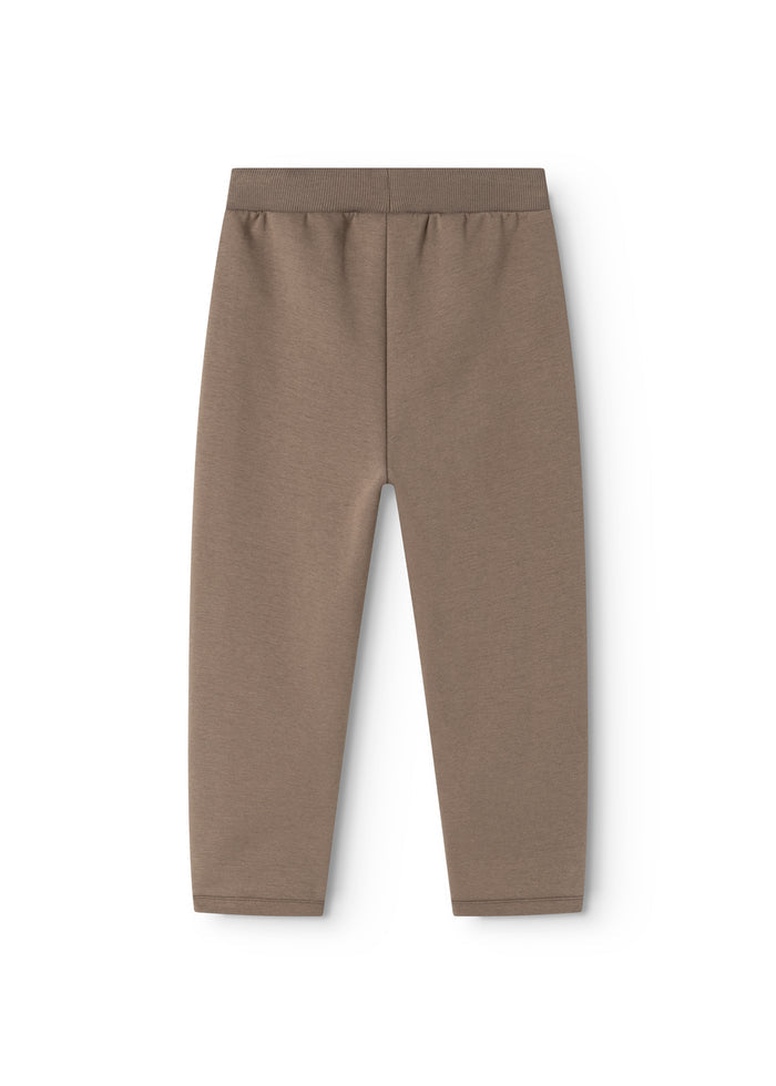 Dusty brown men's trousers with elastic waist and straight, loose legs.