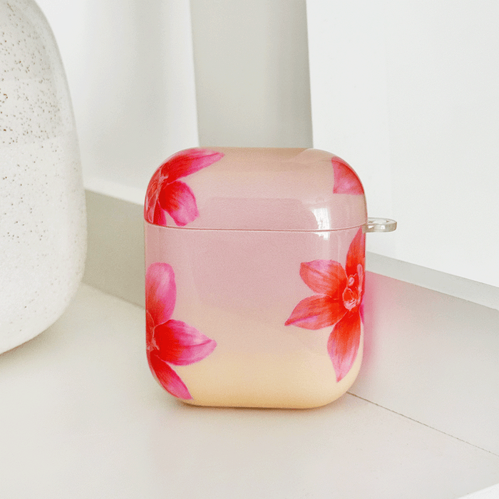 Pink AirPods Case with pink and orange orchid flower design.
