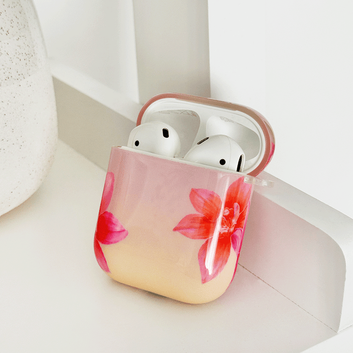 Pink AirPods Case with pink and orange orchid flower design.