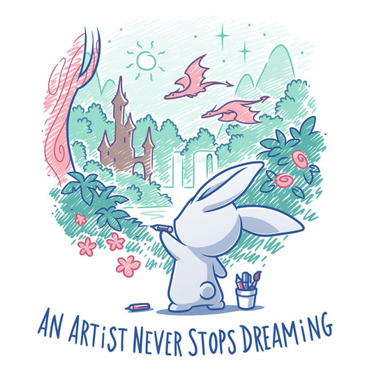 Premium Cotton T-shirt_TeeTurtle white An Artist Never Stops Dreaming apparel  featuring a bunny drawing a whimsical landscape with a castle, trees, and flying dragons. Caption reads, "an artist never stops dreaming".