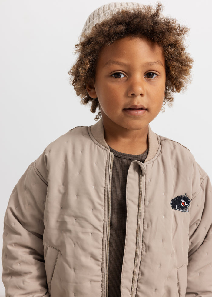 Barely beige stripe with ribbing and reverse side.