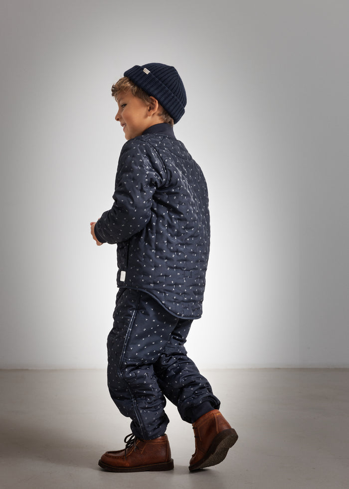Dark blue knit hat for children, ribbed edge and solid color knit.