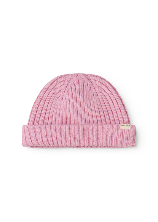 Pink knit hat with ribbed knit pattern and small tag on the side