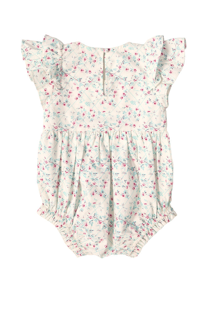 The Baby Hattie Romper in Pansy Trellis by Ivy City Co features a delicate floral print, ruffled cap sleeves, elastic leg openings, a gathered waist, and back button closure—perfect for Easter!.