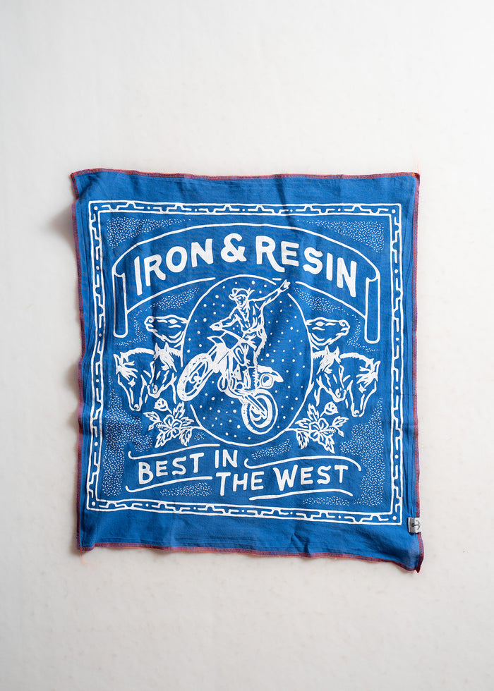 Blue bandana with "Iron & Resin" and "Best in the West" text, featuring a motorcyclist and horses in a detailed white design.