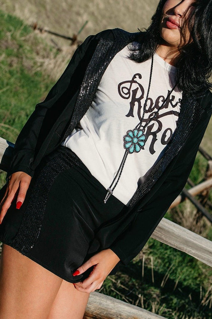 Black western mini skirt styled for gothic cowgirl outfits, country concert fashion, edgy western looks and festival cowgirl style from Sand + Charcoal Boutique.