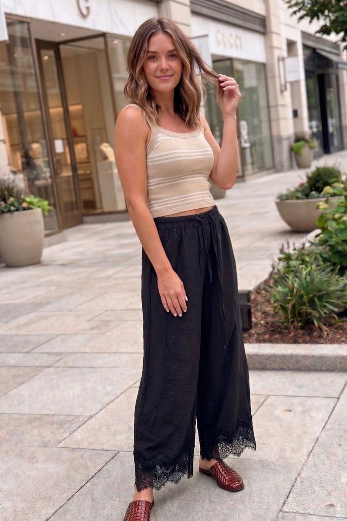 lace trim barrel-leg pants with a relaxed wide-leg silhouette, elastic drawstring waistband, and delicate boho lace hem detailing