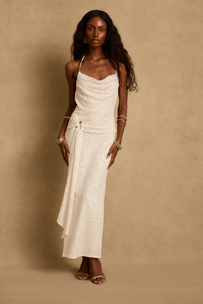 Bonita ivory sequin maxi dress worn with gold bangles and strappy heels, cowl neckline.