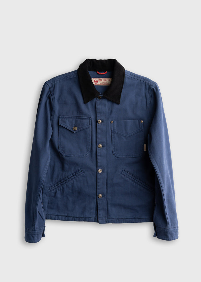 Blue denim jacket with black collar, buttoned front, and four pockets on a plain background. Iron and Resin label visible.