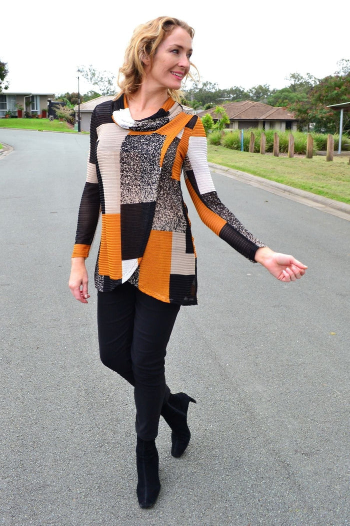 Caramel cowl neck tunic top by Caroline Morgan, shown on a hanger with soft fabric and relaxed fit, stylish and comfortable.