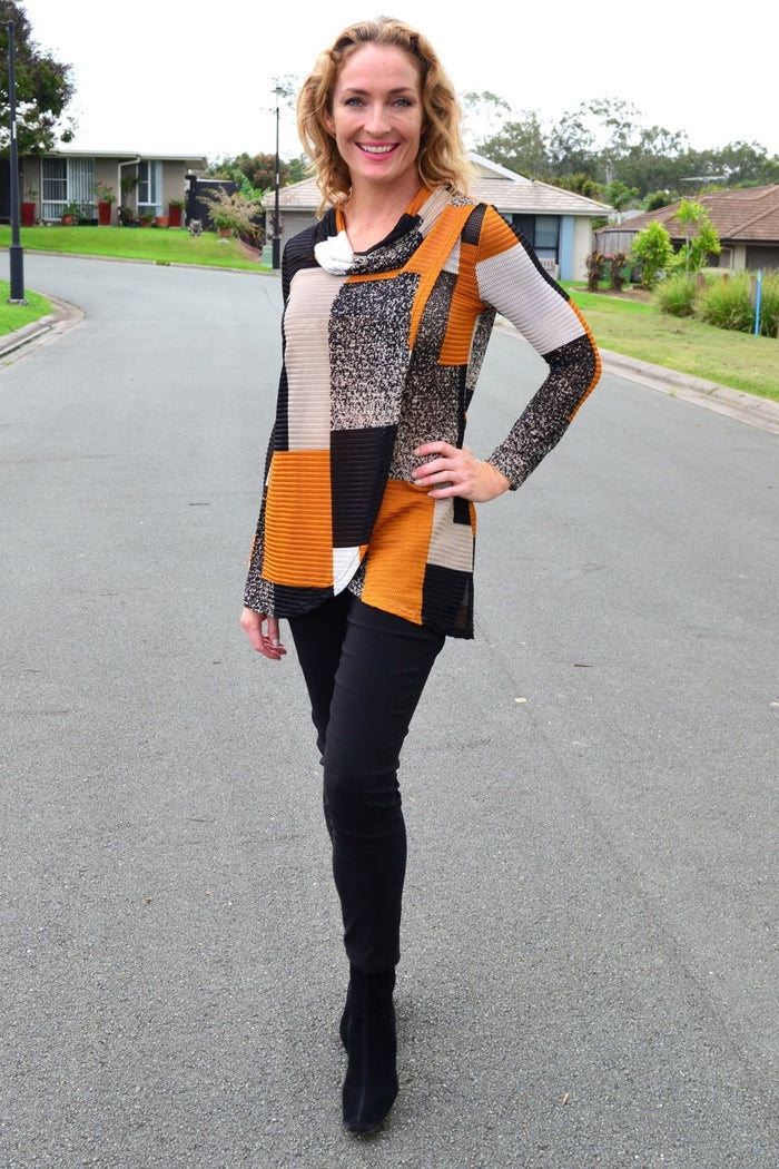 Caramel cowl neck tunic top by Caroline Morgan displayed on a hanger, showcasing the soft fabric and relaxed fit.