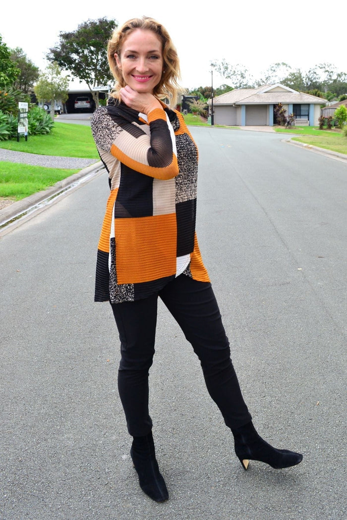 Caramel cowl neck tunic top by Caroline Morgan, displayed on a hanger with soft fabric texture and relaxed fit.