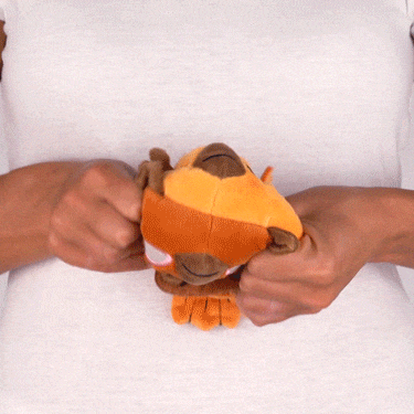 Two hands twisting a Casting Shadows: Talon Lightfeather & Talon the Dark Storm Reversible Plushie from Unstable Games to show its flexibility, against a white background.
