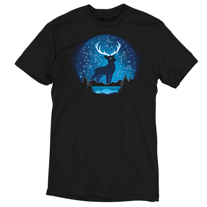 Premium Cotton T-shirt_TeeTurtle Celestial Stag (Glow) black t-shirt featuring a silhouette of a deer with large antlers in a circular frame against a backdrop of a starry night sky with constellation patterns. In the foreground, there are dark silhouettes of coniferous trees, light-blue horizontal lines representing mountains and a body of water.