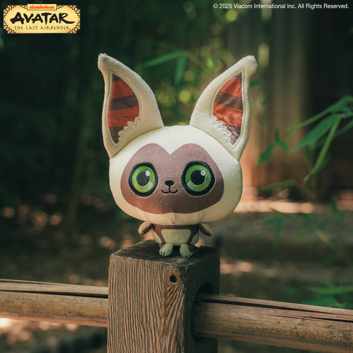 Cloudheads: 5" Momo sitting on top of a bridge post with bamboo and a temple in the background