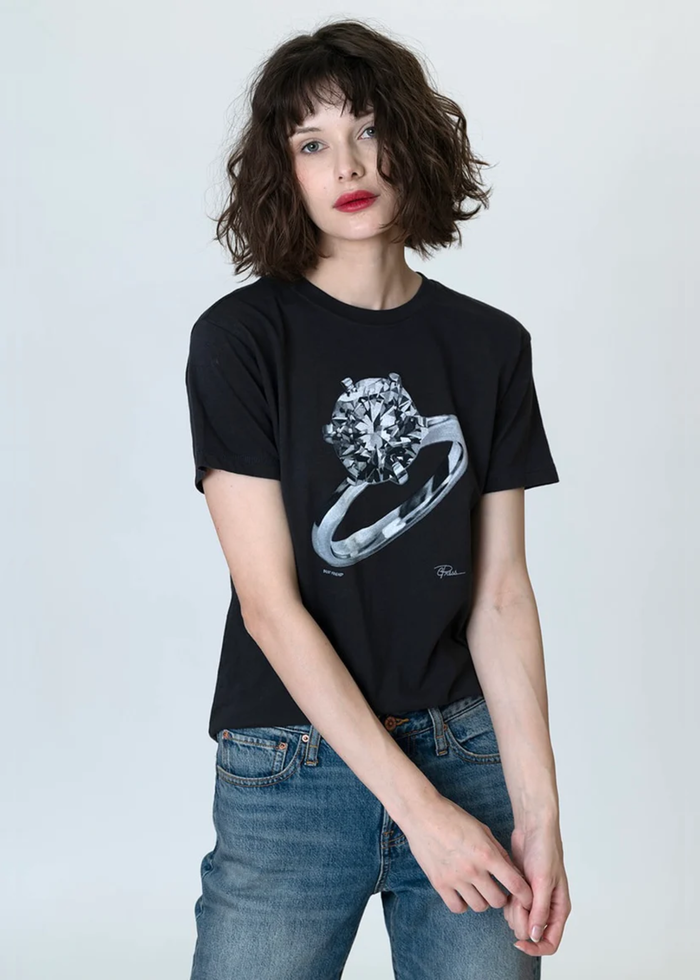 Woman wearing a black tee with an engagement ring graphic
