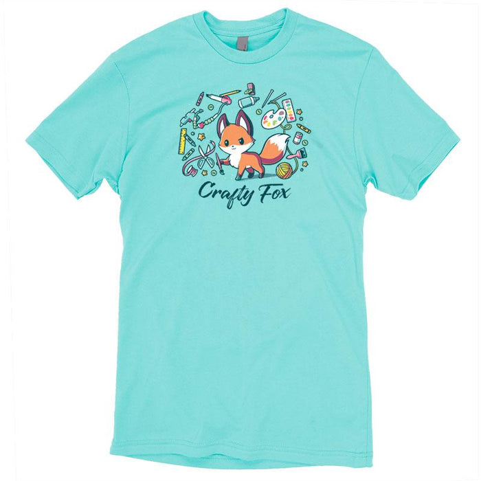 Premium Cotton T-shirt_TeeTurtle Crafty Fox caribbean blue t-shirt featuring a cute fox holding a brush in its forepaw and surrounded by yarn, scissors, ribbon, paint and many other crafting items.