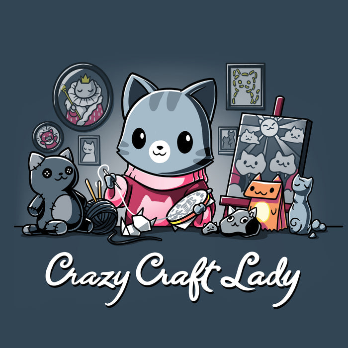 Premium Cotton T-shirt_TeeTurtle denim blue Crazy Craft Lady apparel featuring a cat happily sewing, surrounded by cat themed craft projects. Caption reads, "crazy craft lady".