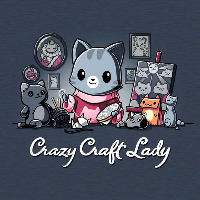 Classic Cotton T-shirt_TeeTurtle heather navy Crazy Craft Lady apparel featuring a cat happily sewing, surrounded by cat themed craft projects. Caption reads, "crazy craft lady".