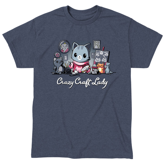Classic Cotton T-shirt_TeeTurtle heather navy Crazy Craft Lady apparel featuring a cat happily sewing, surrounded by cat themed craft projects. Caption reads, "crazy craft lady".