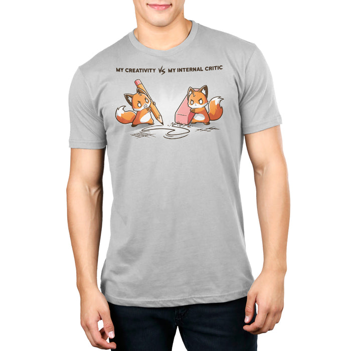Premium Cotton T-shirt_TeeTurtle Creativity vs Critic silver gray t-shirt featuring a fox drawing with a pencil and another fox holding an eraser erasing the pencil drawing while both looking angry at each other. "MY CREATIVITY VS MY INTERNAL  CRITIC"  is written on top.