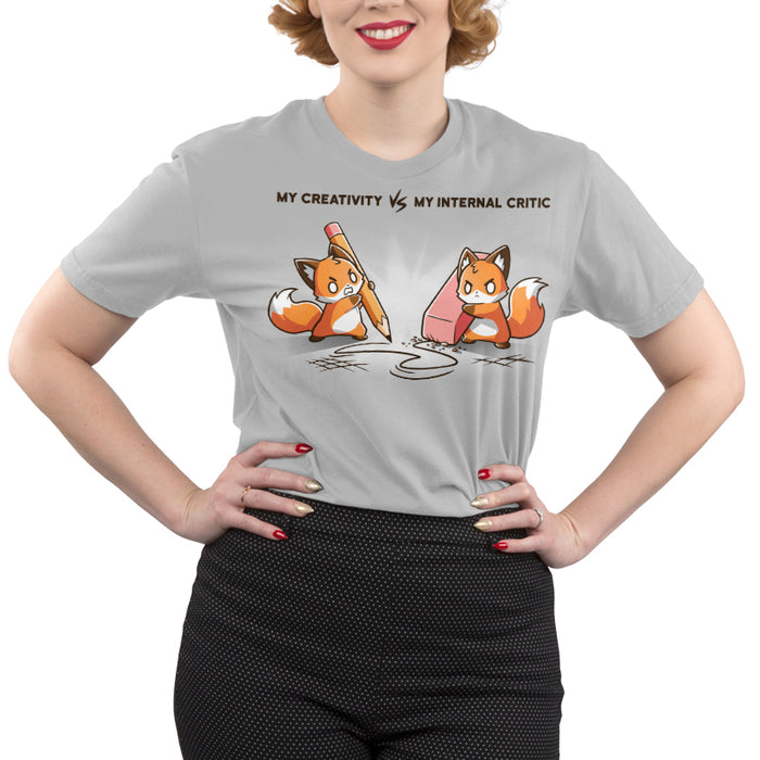 Premium Cotton T-shirt_TeeTurtle Creativity vs Critic silver gray t-shirt featuring a fox drawing with a pencil and another fox holding an eraser erasing the pencil drawing while both looking angry at each other. "MY CREATIVITY VS MY INTERNAL  CRITIC"  is written on top.