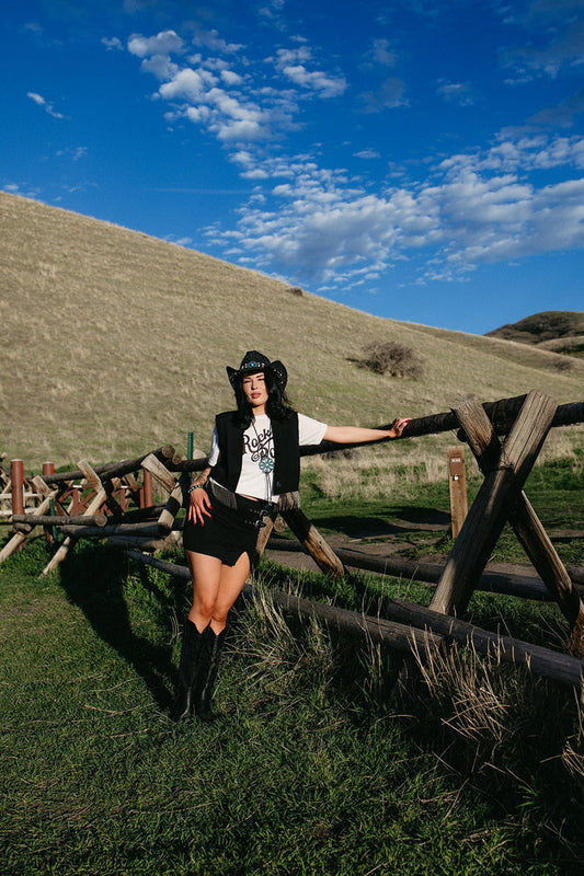 black mini skirt, edgy western style skirt for country concerts, fitted high waist summer skirt for western edgy outfits. Buckles on the skirt