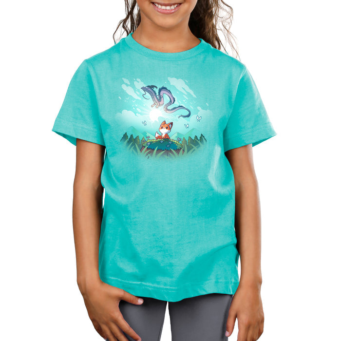 Premium Cotton T-shirt_TeeTurtle Caribbean blue Dragon Daydreams apparel featuring a fox in a mountainous forest looking up at a dragon flying in the sky.