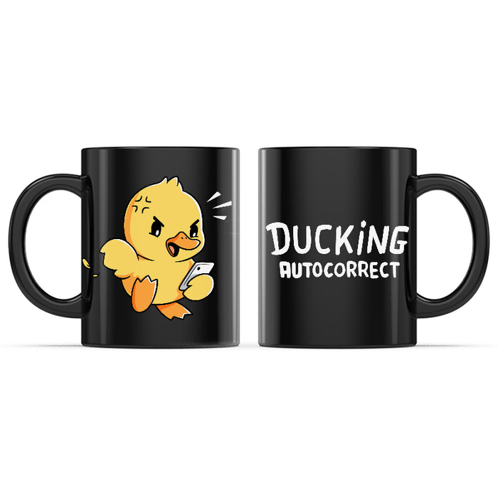 Ceramic Mug_TeeTurtle Ducking Autocorrect black mug featuring an angry duck holding a smartphone.
