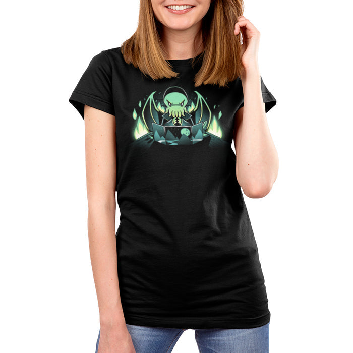 Premium Cotton T-shirt_TeeTurtle Dungeon Monster black t-shirt featuring a monster with green skin, tentacles, and wings sitting behind a gaming map with mountains and a moon, surrounded by glowing green flames.