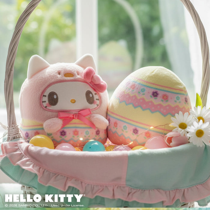 Easter Egg Hello Kitty 4" Reversible Plushie in an Easter basket with flowers, and Easter eggs sitting on a windowsill