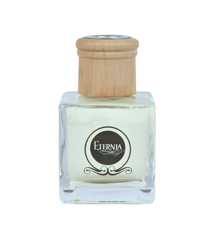 Glass reed diffuser bottle with cork-style wooden stopper and Eternia® logo label