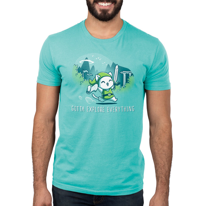 Premium Cotton T-shirt_TeeTurtle Gotta Explore Everything Caribbean Blue apparel featuring an excited magical cat holding a map and sword running through the mountains.