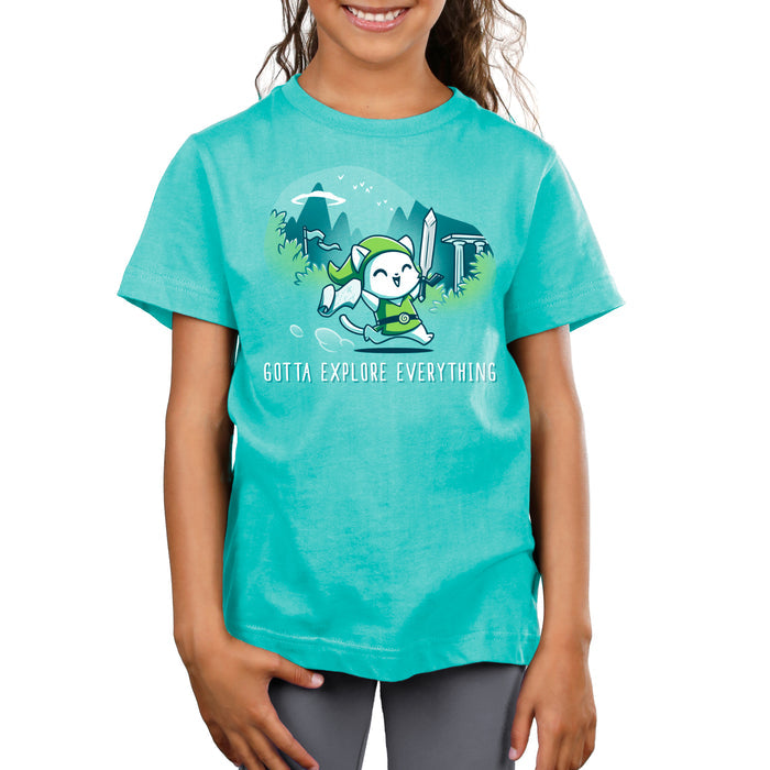 Premium Cotton T-shirt_TeeTurtle Gotta Explore Everything Caribbean Blue apparel featuring an excited magical cat holding a map and sword running through the mountains.