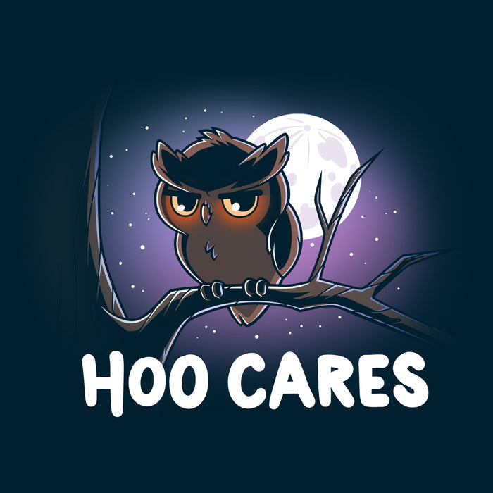Premium Cotton T-shirt_TeeTurtle navy blue Hoo Cares apparel featuring an owl with a deadpan expression perched on a branch with a moonlit sky in the background with the caption, “Hoo Cares“.