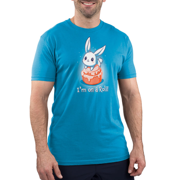 Premium Cotton T-shirt_TeeTurtle cobalt blue I'm On A Cinnamon Roll apparel featuring a cute cartoon bunny sitting on top of a glazed cinnamon roll with the text "I'm On a Roll!" written below.