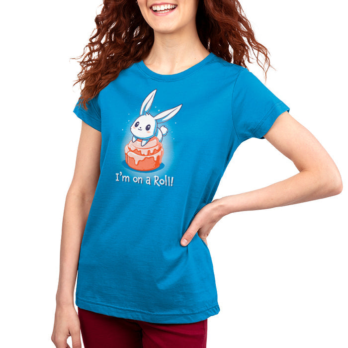 Premium Cotton T-shirt_TeeTurtle cobalt blue I'm On A Cinnamon Roll apparel featuring a cute cartoon bunny sitting on top of a glazed cinnamon roll with the text "I'm On a Roll!" written below.