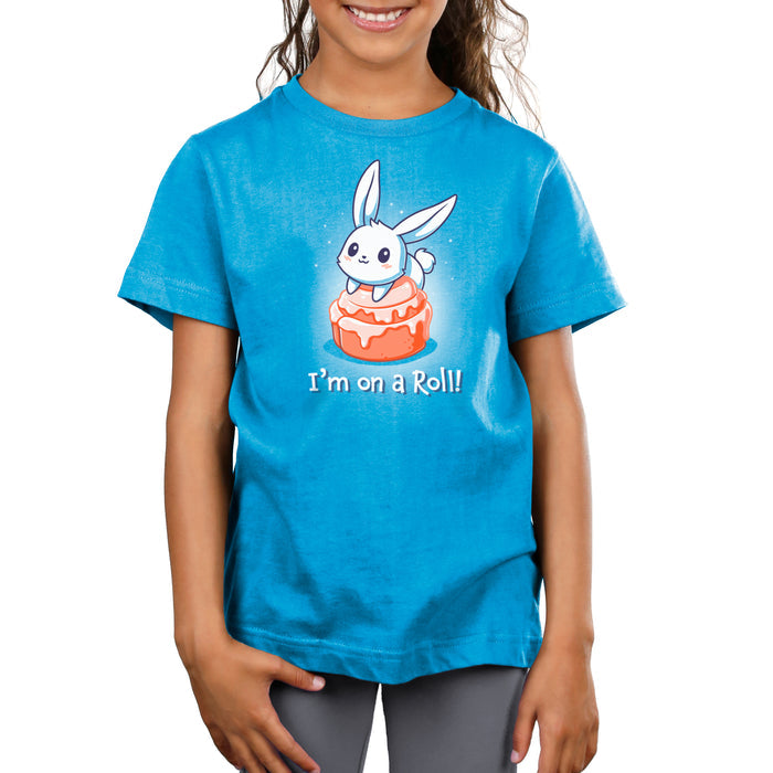 Premium Cotton T-shirt_TeeTurtle cobalt blue I'm On A Cinnamon Roll apparel featuring a cute cartoon bunny sitting on top of a glazed cinnamon roll with the text "I'm On a Roll!" written below.