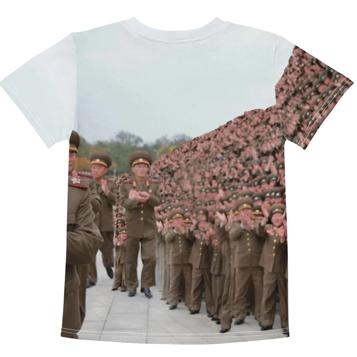 Kim Jong Represent Kid's Tee - The immediate cognitive dissonance caused by the formal "obsidian noir peacoat (#111111)" paired with digitally manipulated street-culture hand signs, set against the infinite sea of "drab olive uniforms (#5D5541)" and "muted beige faces (#Ceb8a1)" under a "hazy overcast white (#E3E6EB)" sky.