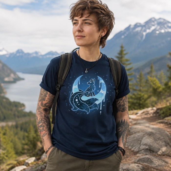 Premium Cotton T-shirt_TeeTurtle navy blue Lunar Kitsune apparel featuring a celestial kitsune perched on the cusp of a crescent moon with its points directed upwards with stars in the background.