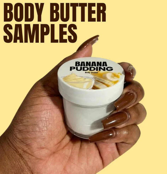 Hand holding a small jar of banana pudding body butter sample against a yellow background.