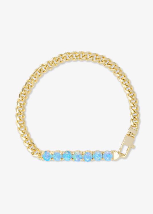 Gold chain bracelet with seven blue opals on a white background