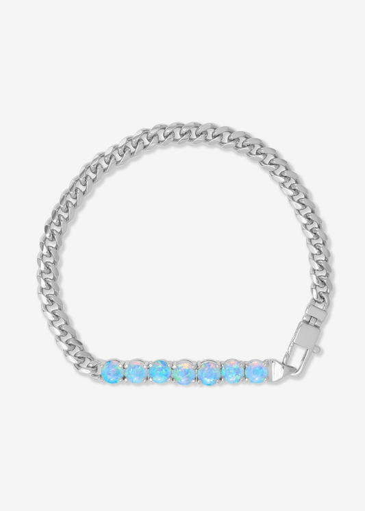 Silver chain bracelet with seven blue opal stones on a white background