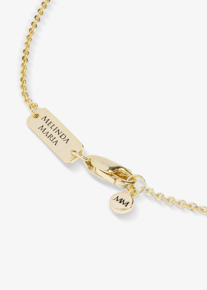 Close up of the clasp of a gold chain necklace