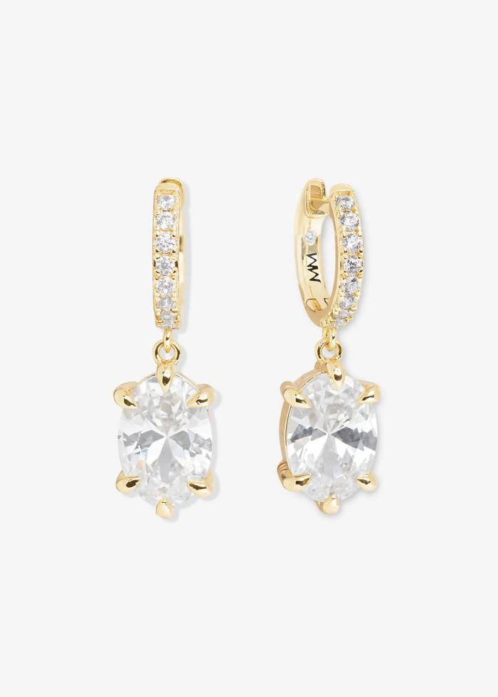 A pair of gold and simulated diamond huggie earrings