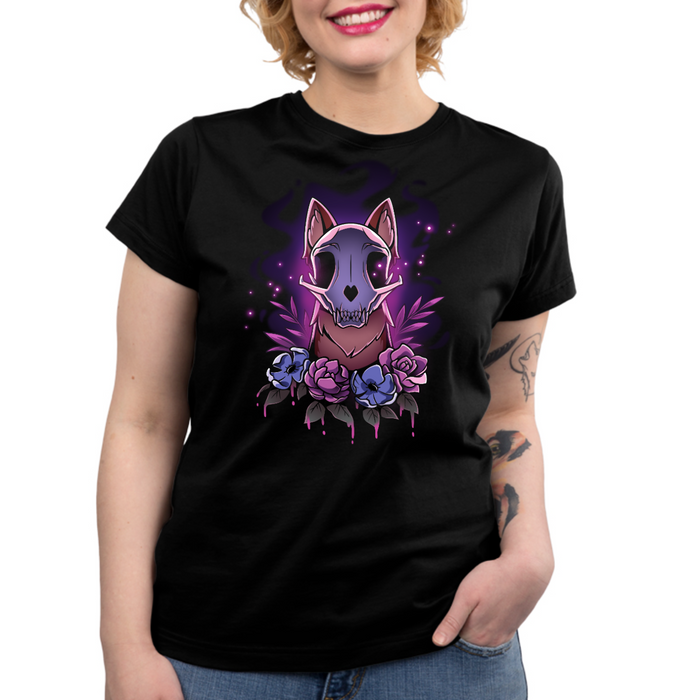 Premium Cotton T-shirt_TeeTurtle black Memento Vulpes Premium Cotton T-shirt featuring a fox skull resting on a weathered log with four purple flowers below, illuminated by a mystical purple glow.