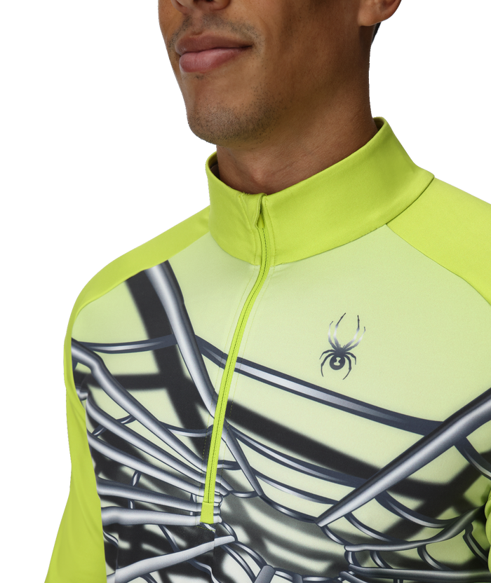 Close-up of a person wearing a bright green athletic jacket with a spider logo.
