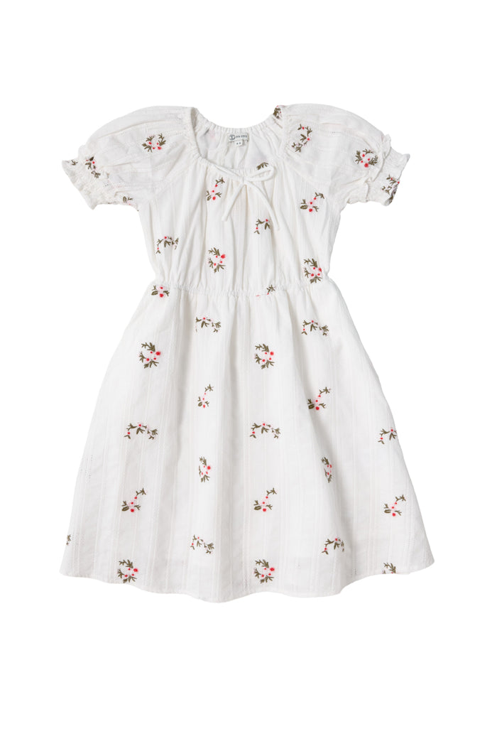 The Mini Jessie Dress in Ditsy Embroidery by Ivy City Co is a white, short-sleeved cotton dress featuring puffed sleeves, a gathered waist, and pink ditsy embroidery for a delicate, vintage-inspired look.