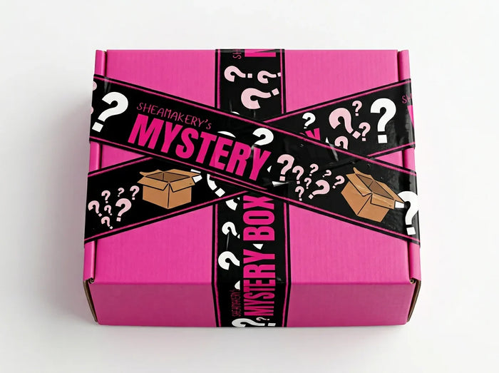Pink shipping box with branded sheamakery tape